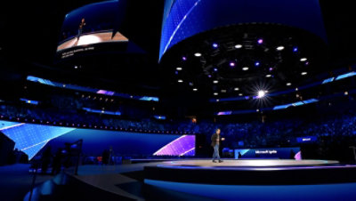 A man walking on a podium.