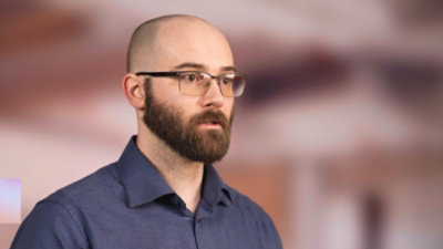 Person speaking during a presentation.