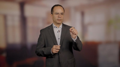 Person presenting to an audience.