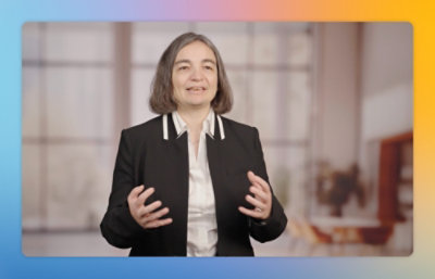 Person presenting information on camera in a studio environment