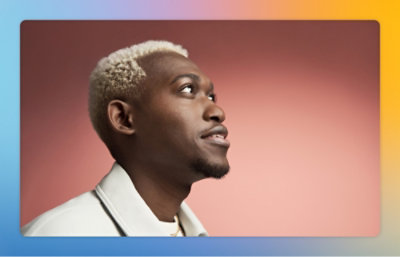 Person shown in profile against a soft, solid‑color background, facing to the side.