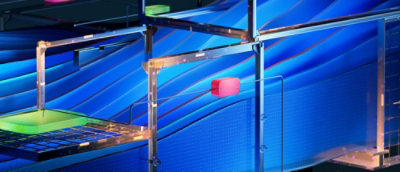 A blue abstract graphic is visible on the screen.