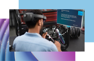 A man wearing glasses and working in a factory.