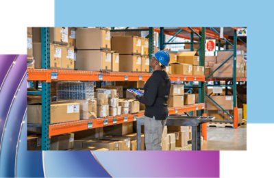 Workers inventorying and organizing items in a warehouse.