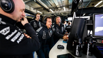 FI team wearing headsets monitoring data in a high-tech control room