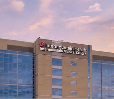 Intermountain Health name on building and showing the sky above the building.