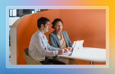Man and woman working together on a laptop
