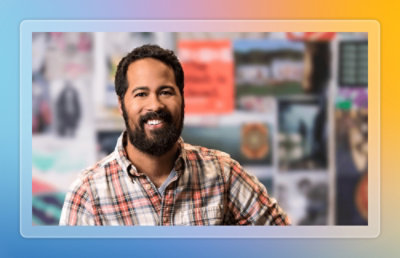 A person smiling towards camera.