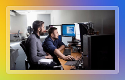 Two employees working in office.