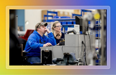 A man and a woman working on computer.