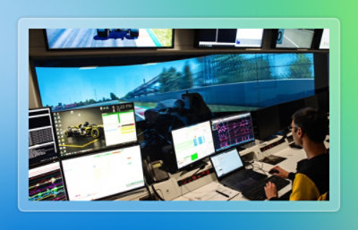 A person sitting in front of multiple monitors.