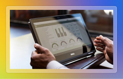 A close-up of hands holding a laptop.