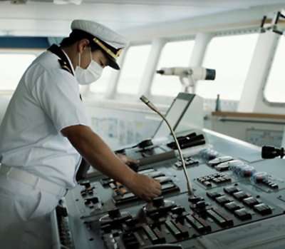 A person's hands on a control panel.
