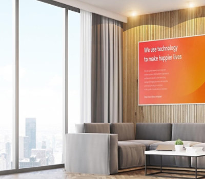 Modern office lounge with wall display.