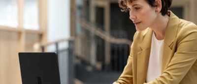 Women working on the laptop and smiling