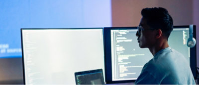 A person looking at a computer screen