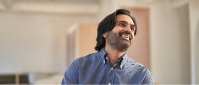 A person looking away and smiling