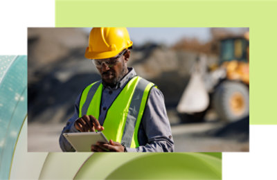 A person wearing a safety vest and hard hat