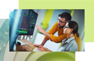 A person and another person looking at a computer screen