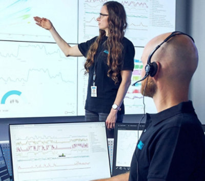 A person pointing at a screen