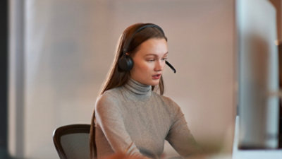 A woman wearing a headset.