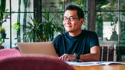 A Man looking into laptop.