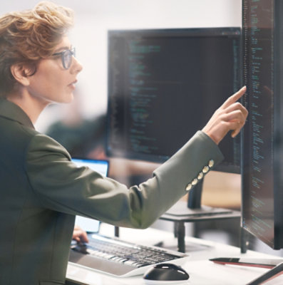 A women pointing at a desktop screen