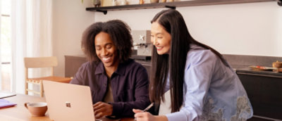 A man and women working on laptop
