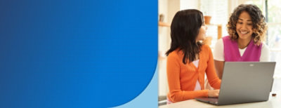 Women looking at a computer screen.