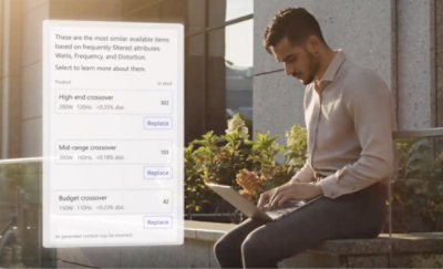 一个人坐在长椅上使用计算机
