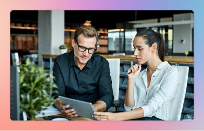 A man and a woman working with tablet