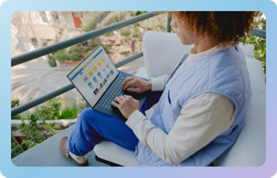 A person sitting on a chair using a computer