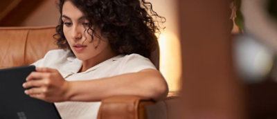 Two person are discussing and their laptops are open