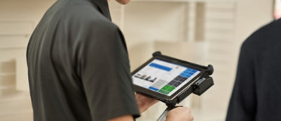 Person holding a tablet