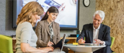 A group of people sitting at a table.