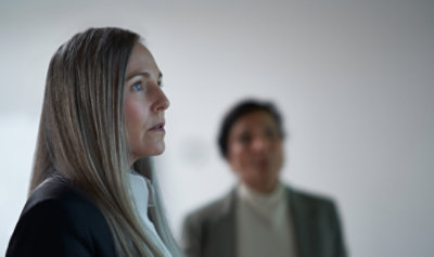 Two person looking aside.