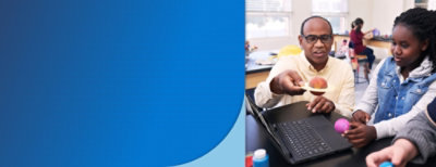 A person and a child looking at a computer.