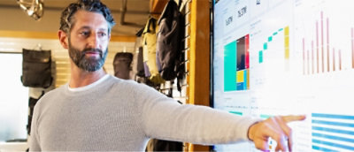 A person pointing at a computer screen