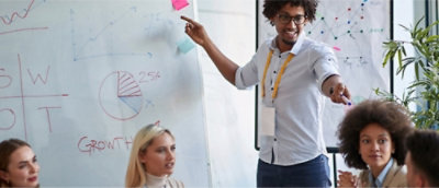 A person pointing at a whiteboard