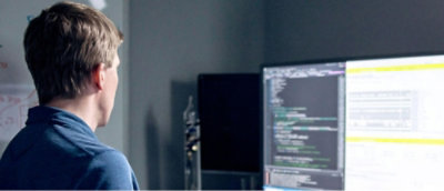 A person standing in front of a computer