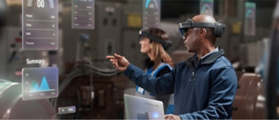 A person wearing virtual reality goggles pointing at something