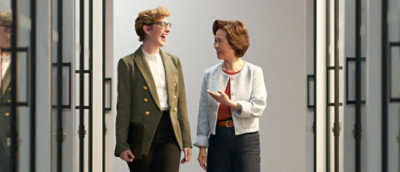 Two woman discussing with each other