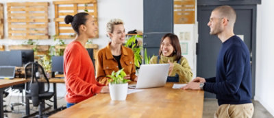 A group of people standing and discussing