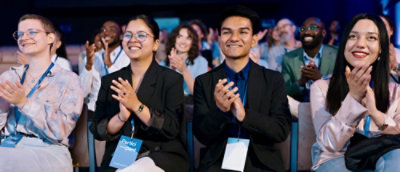 A group of people laughing and clapping