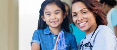 A girl and women smiling