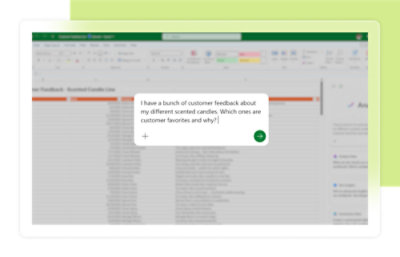 A computer monitor displaying a spreadsheet program, surrounded by office supplies in a green and white color scheme.