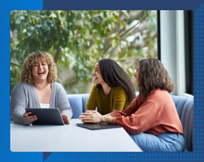 A group of women laughing at a table