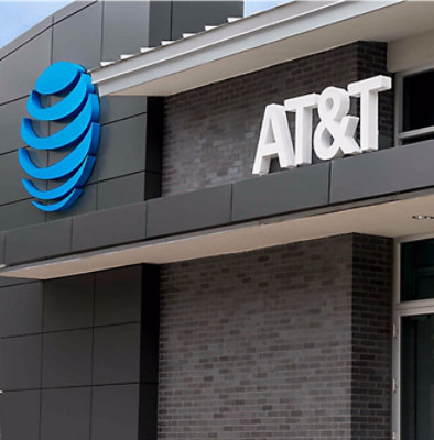 A grey wall with a blue AT&T logo.