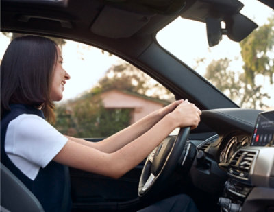 women driving a car