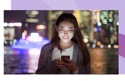 A woman looking at her phone.